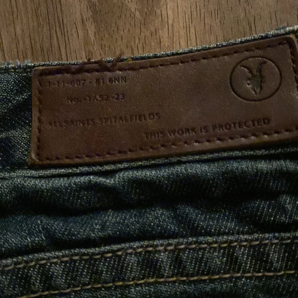 All Saints Spitalfields Jack’s Place skinny dark blue jeans from Neiman Marcus